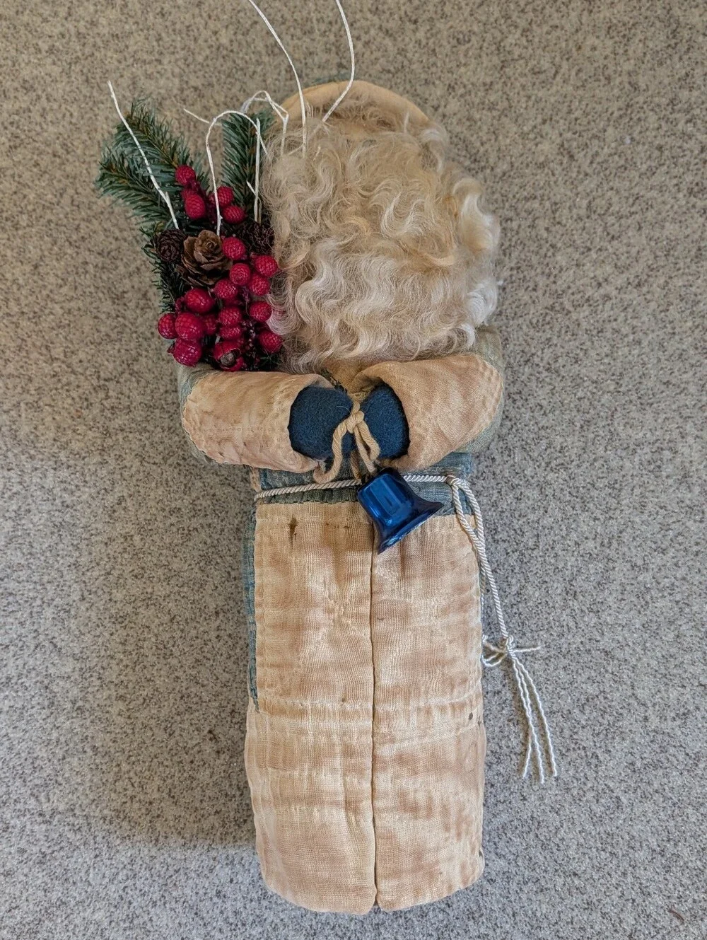 FOLK ART SANTA CLAUS wearing an antique quilt